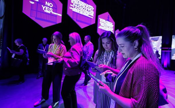 Delegates at IMEX America 2022 using VR headsets 