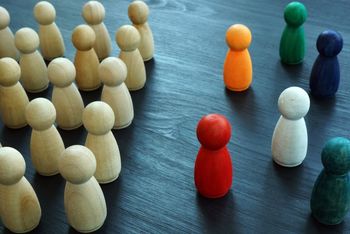 Illustration showing a group of people being excluded from a white group