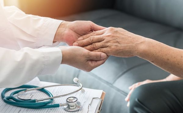 A Geriactric nurse with patient