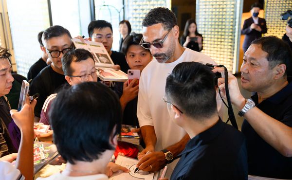 Rio Ferdinand signs autographs at the World Football Summit