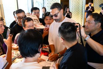 Rio Ferdinand signs autographs at the World Football Summit