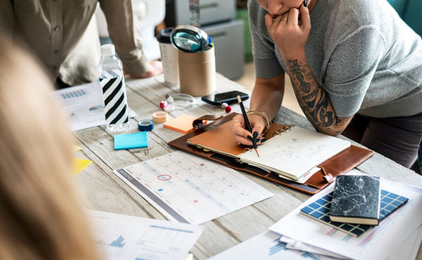 meetings planners taking notes
