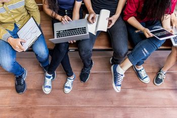 Students on a bench aerial shot