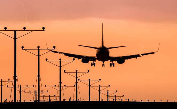 airline landing at dusk