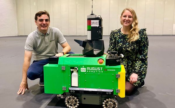 Alex Wyatt from August Robotics together with Lionel the robot and Natalie Sykes Sustainability Manager at ExCeL