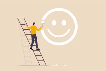 Man up stepladder painting smiley face