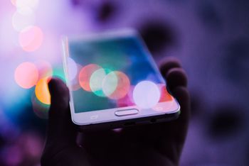 A smartphone in filtered coloured light