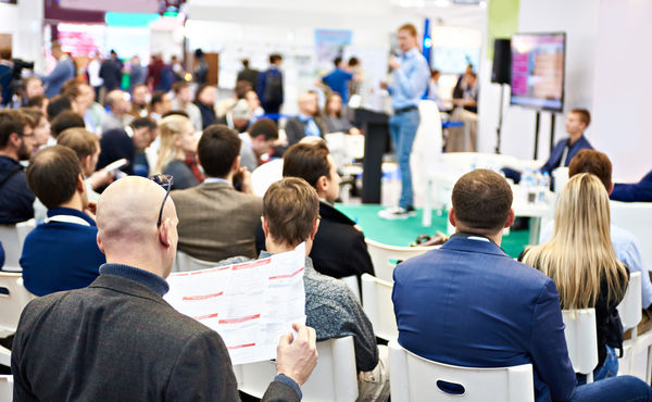 Attendees at a breakout session during a trade show