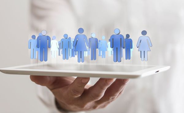 Image of computer generated avatars floating on a laptop to represent membership