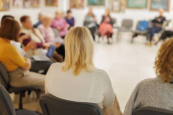Members engaged in a meeting ...