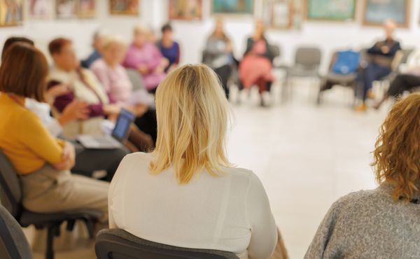 Members engaged in a meeting ...