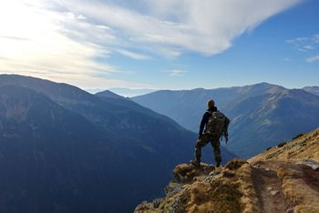 Photo by <a href='https://unsplash.com/@wthen?utm_content=creditCopyText&utm_medium=referral&utm_source=unsplash'>Wojciech Then</a> on <a href='https://unsplash.com/photos/man-on-top-of-mountain-under