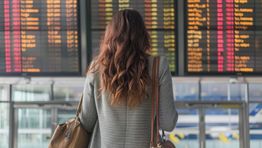 Airport passenger departures board AdobeStock