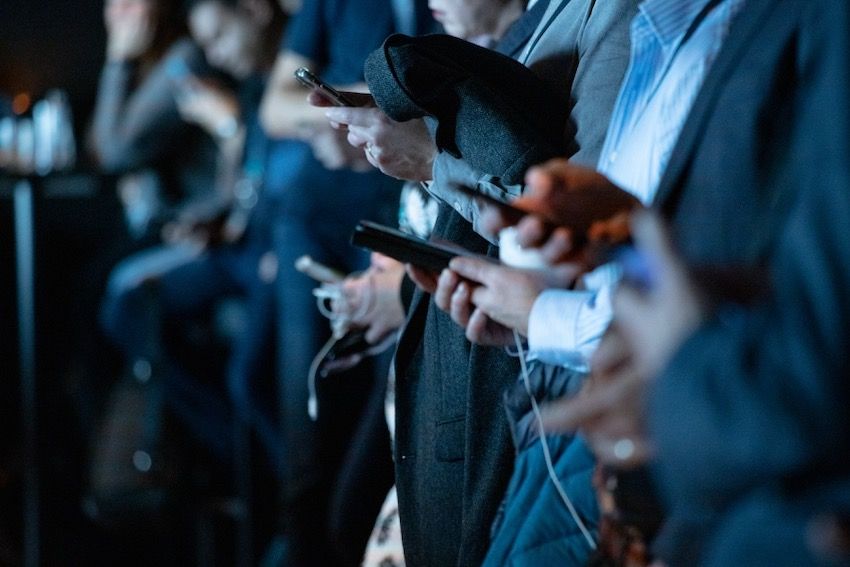 Business people reading mobile