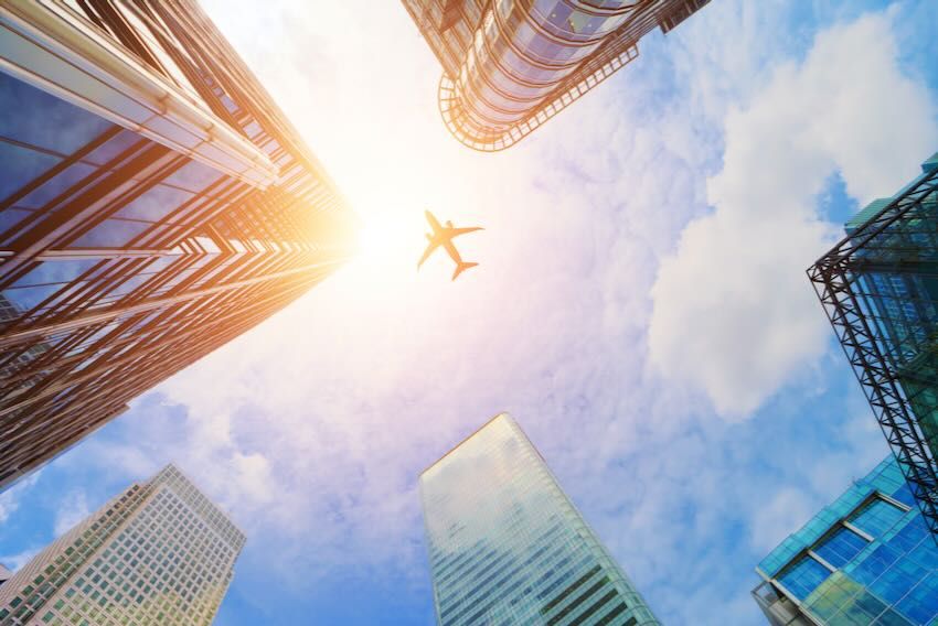 Plane buildings blue sky
