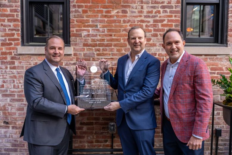 (left to right); Marriott's Anthony Capuano, Douglas Development's Normal Jemal and TPG's Ben Perelmuter during the ceremony. (left to right); Marriott's Anthony Capuano, Douglas Development's Normal Jemal and TPG's Ben Perelmuter during the ceremony.