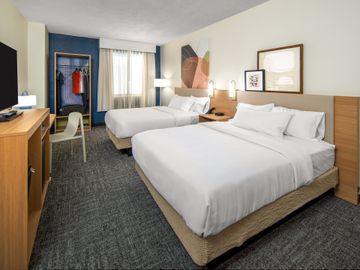 Guestrooms will include simple, streamlined furniture, an open closet, a mini-refrigerator and a multi-purpose work surface.