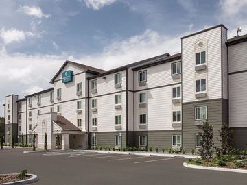 Latest HITs: Noble buys 10 Woodsprings; Oaktree, Trinity refi; Asia Pac deal trends