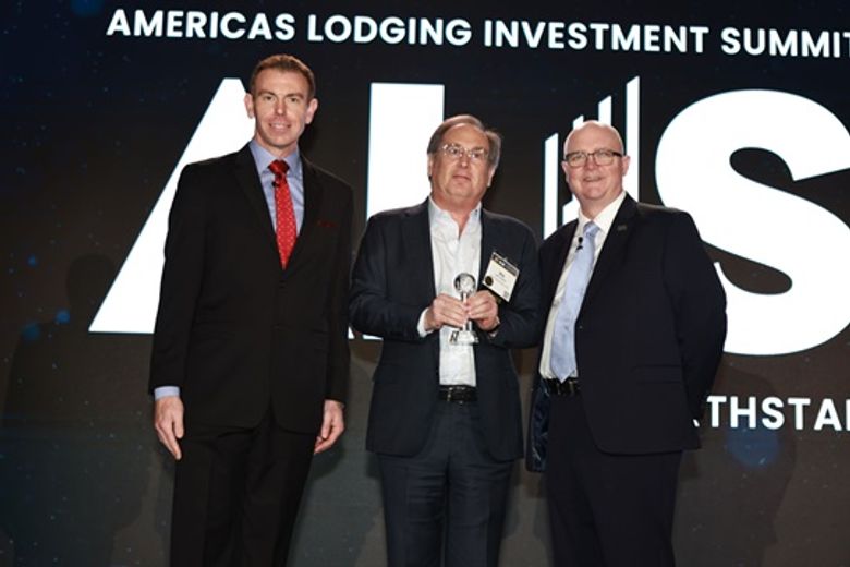 Ira Mitzner, RIDA Development (center) accepts Development of the Year from Jonathon Zink (l.) and JP Ford.