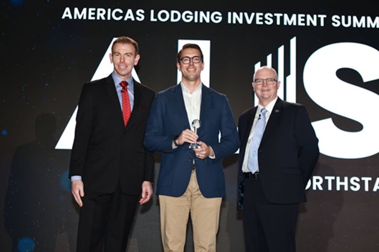 Will Woodworth, Peachtree (center) accepts Development of the Year from Jonathon Zink (l.) and JP Ford.