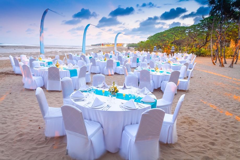A beach dinner setting facing the Indian Ocean at Courtyard by Marriott Bali Nusa Dua Resort.