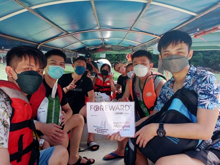 The Forward Realty team on their island hopping day in Langkawi, a natural paradise.