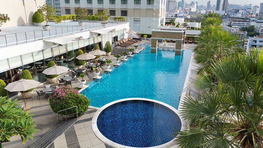 Plenty of ways to recharge at The Berkeley Hotel Pratunam. Rooftop pools and swim-up bar pictured.