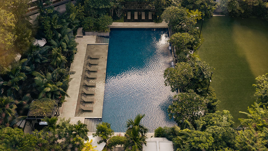 The Garden is a lush outdoor lawn designed for mindful movement sessions and relaxed gatherings.