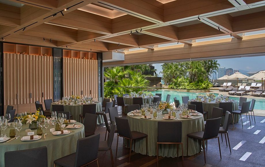 This exceptional venue combines captivating open-air views of the pool and gardens with indoor comfort.