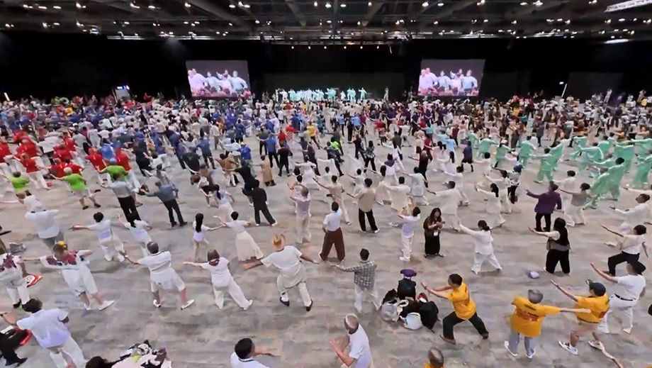 Nearly 4,000 delegates representing six continents gathered inside AsiaWorld-Expo to set the world record for the largest group Tai Chi session.