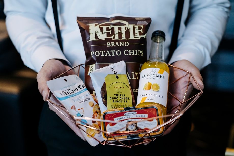 A customised complimentary minibar delights delegates with their favourite snacks after a long flight or meeting.