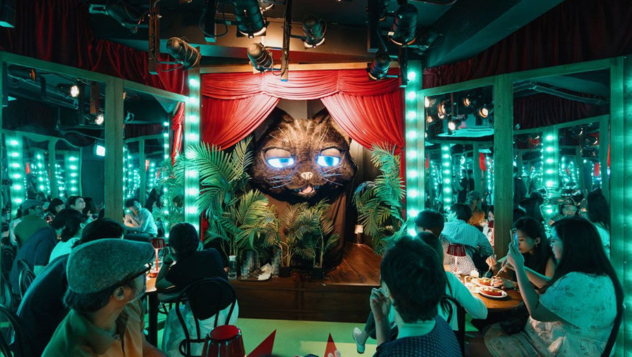 Participants dine and interact their way through a whimsical wonderland. Credit: Wonderland Upside Down