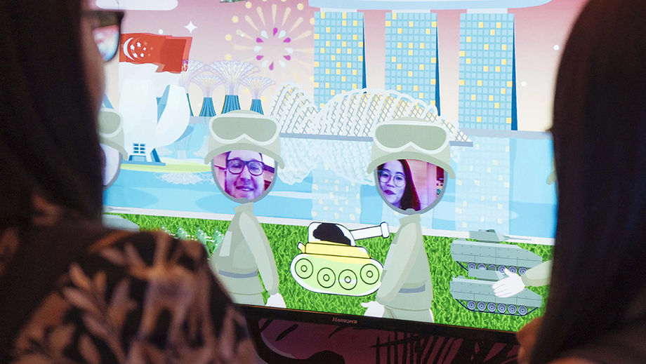 An event attendee drawing on Infinity Core’s digital mural.