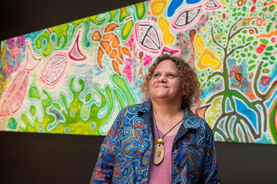 Embedding indigenous representation into employment, partnerships and event design. Pictured: First Nations artist Elverina Johnson with her artwork, Reef Connections, commissioned by Cairns Convention Centre.