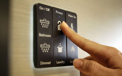 The in-room control panel enables guests to access the room’s lighting, temperature controls and make service requests.