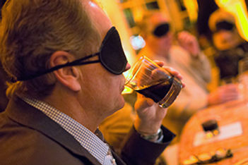 man-in-mask-sipping-drink