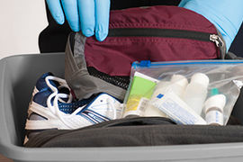What’s Dirtier Than an Airport Toilet? Those Plastic Security Bins We All Have to Touch