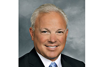 Greg-Champion-president-COO-benchmark