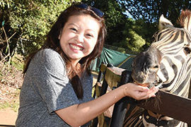 Lily Zhang with zebra
