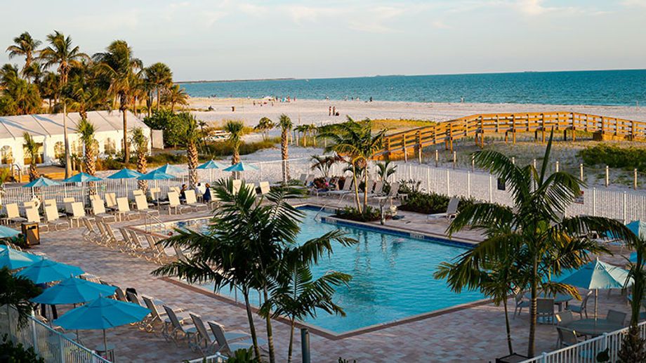 Relax poolside or stroll out to the beach to stick your toes in the Gulf.