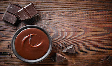 molten-chocolate-wood-table-gettyimages-494701394
