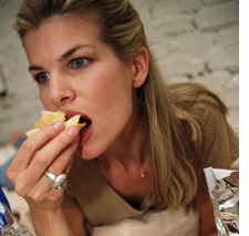 Woman  eating potato chips