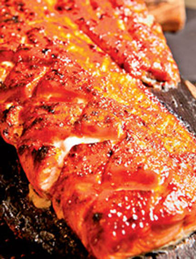 Sazerac's sweet and spicy salmon is roasted
to perfection on a cedar plank.