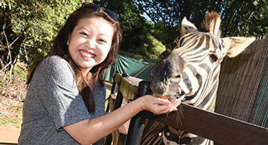 Lily Zhang with zebra