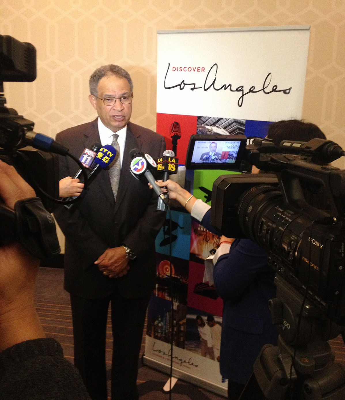 Los Angeles Tourism & Convention Board President & CEO Ernest Wooden Jr. talks to Chinese media at the launch of the "NiHao China" marketing initiatives.
