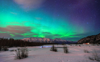 Beautiful green Northern light (Aurora Borealis) at Knik River in Alaska. (Photo via CNaene / iStock / Getty Images Plus)