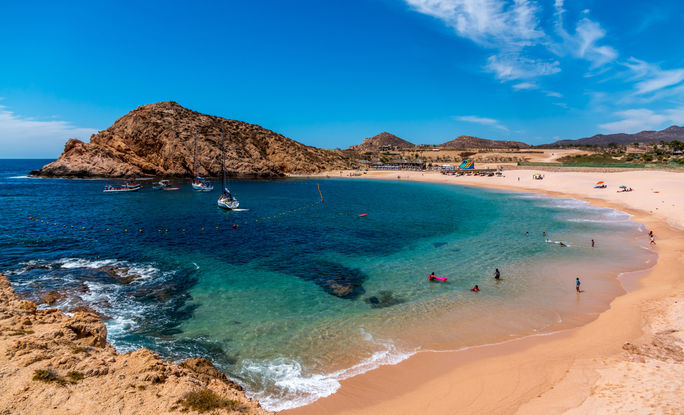 Beautiful Santa Maria beach by Cabo San Lucus has full life guarding and bathroom facilities. It is a sheltered beach that provides safe swimming and snorkeling areas. (photo via rand22 / iStock / Getty Images Plus)