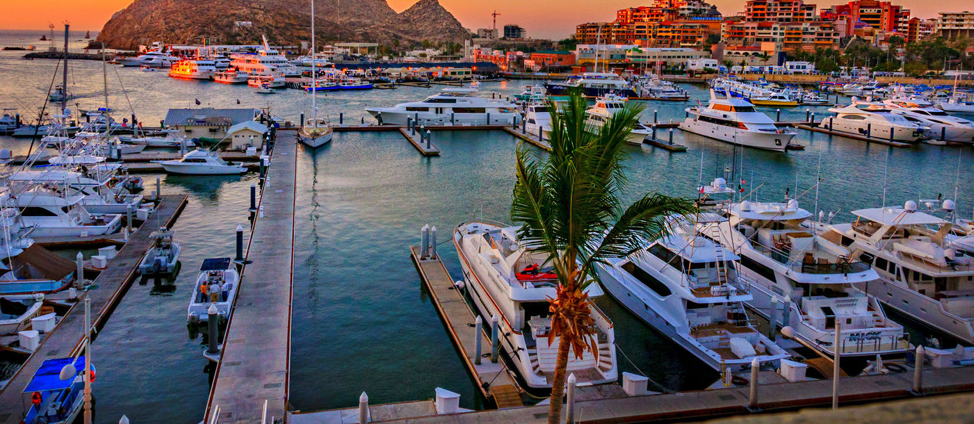Cabo San Lucas Marina at sunset (Photo via LindaYG / iStock / Getty Images Plus)