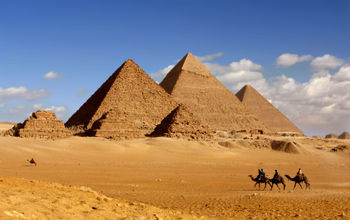 morning light on pyramids (photo via sculpies / iStock / Getty Images Plus)