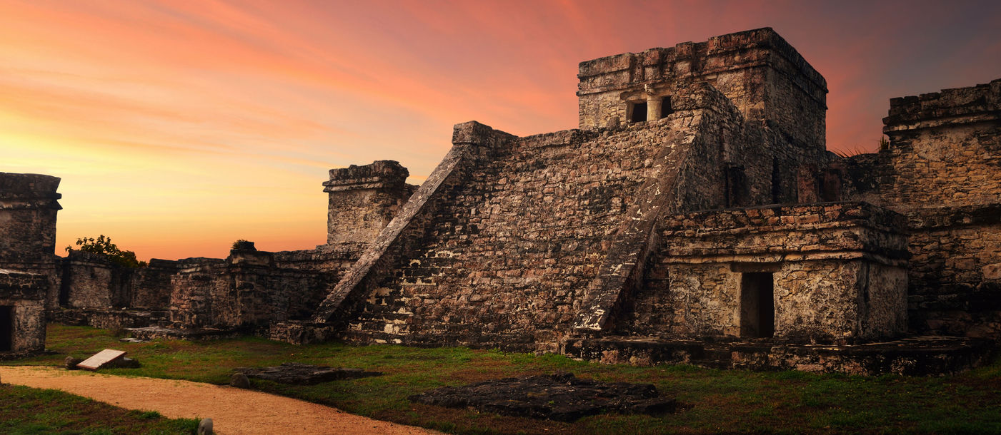 Castillo fortress at sunset in the ancient Mayan city of Tulum, Mexico (photo via Soft_Light / iStock / Getty Images Plus)